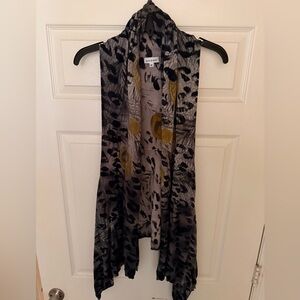 Adore sleeveless cardigan vest with a grey leopard and yellow peacock print.
